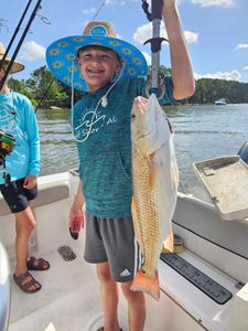 Redfish caught while fishing in Orange Beach AL displayed on boat deck