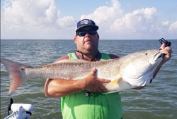 Angler with a 33-inch fish in Matagorda