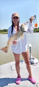 A person enjoying a fishing adventure in Matagorda