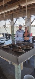 Two people fishing in TX