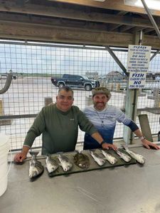Two people enjoying a day of fishing in Matagorda
