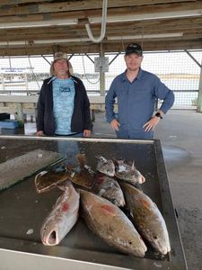 Two anglers with a big 24-inch catch in Matagorda