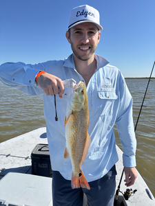Nice redfish on the boat today! Clear skies made for perfect fishing conditions.