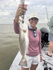 Reeling in the best Spotted Weakfish under partly cloudy Matagorda skies!