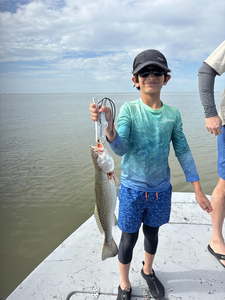 Reeling in the spotted weakfish in Matagorda, TX!