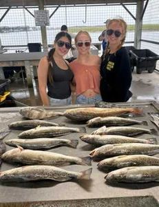 Three anglers with 3 large fish in Matagorda