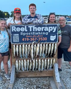 2 fishing rods with 5 people holding them in OH location