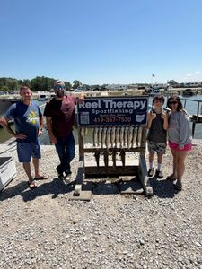 Fishing charter display board showing caught fish at Oregon OH marina dock