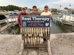 Fishing charter display board showing caught walleye from Oregon OH marina