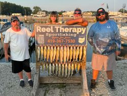 Walleye fishing charter catch displayed on wooden rack at Oregon OH marina