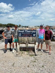 Successful fishing charter display board showing multiple walleye catch at Oregon OH marina