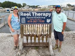 Fishing charter display board showing caught walleye from Oregon OH trip