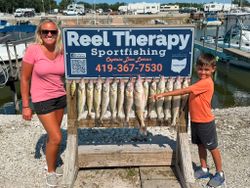 Successful walleye fishing trip in Oregon OH with full stringer of fresh caught fish displayed at marina