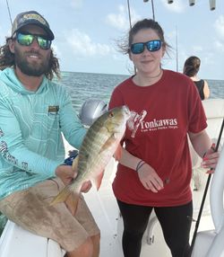 Two anglers fishing on the shore of Big Pine Key
