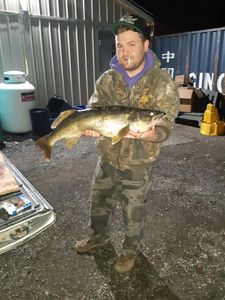 A person fishing in the great outdoors of ON