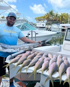 Angler holding 4 big fish caught in Islamorada