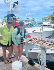 Group of 3 people fishing in Islamorada