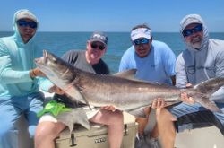4 people fishing in Oxford with a 48 inch fish
