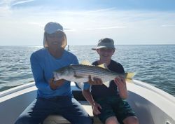 Striped bass caught by two people in MD