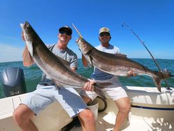 Two anglers hold their catch of 2 big fish in Gloucester County