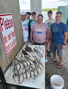 Group of 6 people fishing together at Port Orange
