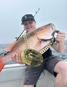 Angler with a 23-inch catch in Port Orange