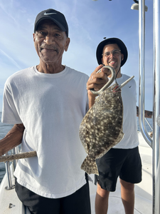 Landed a big Southern Flounder while braving the partly cloudy weather with storm potential!