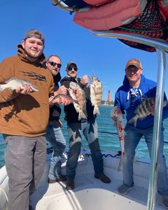 4 people fishing in Port Orange with 4 fish