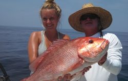 Two people fishing in Destin