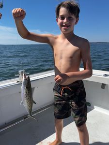 Fisherman holding a Spanish Mackerel in VA