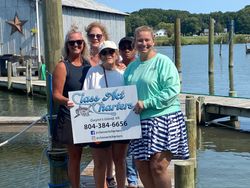 5 people enjoying fishing trip on Gwynn Island