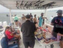 Group of 9 people fishing on Gwynn Island