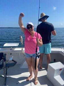 2 small fish caught by a person on Gwynn Island