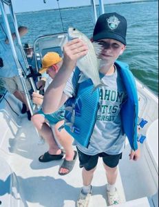 Reeling in the day at Grapevine Lake Fishing.