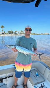 A person fishing for a king mackerel in Florida
