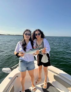 A photo of two people fishing for Spanish mackerel in Florida.