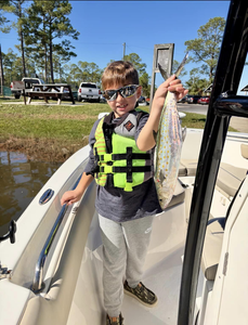 Angler holding a 16-inch fish in FL