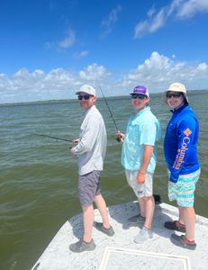 3 people enjoying a fishing tour in Corpus Christi