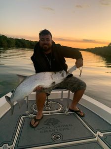 Fisherman posing with a 23-inch catch in Florida