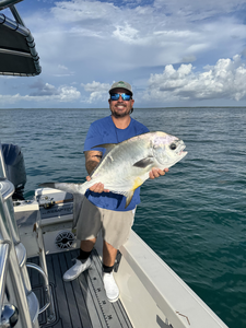 Nice permit on jigging and trolling techniques despite the cloudy conditions!