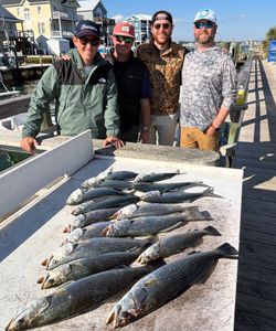 Four spotted weakfish and one bluefish caught while fishing in North Carolina