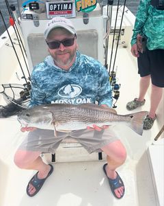 Caught a 21-inch redfish while fishing in NC