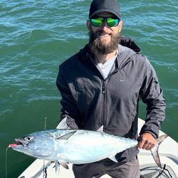 A fisherman catching a little tunny fish in Morehead City