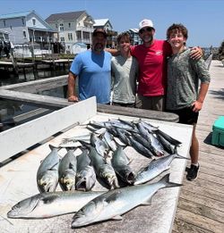 Successful fishing trip in Morehead City NC showing bluefish and Spanish mackerel catch on dock