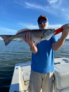 Angler holding a large redfish in North Carolina