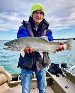 Angler with a large rainbow trout caught in Algonac