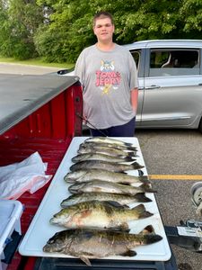 Two anglers fishing in Michigan with big fish