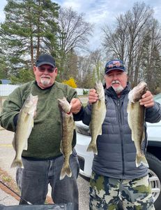 four big fish caught by three people in michigan
