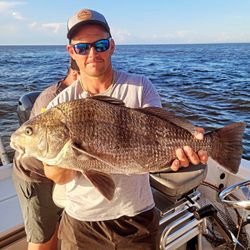 A person fishing for a black drum fish in North Carolina