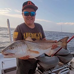 Fisherman catches a redfish in NC